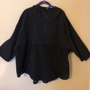 Black rain poncho with sleeves
